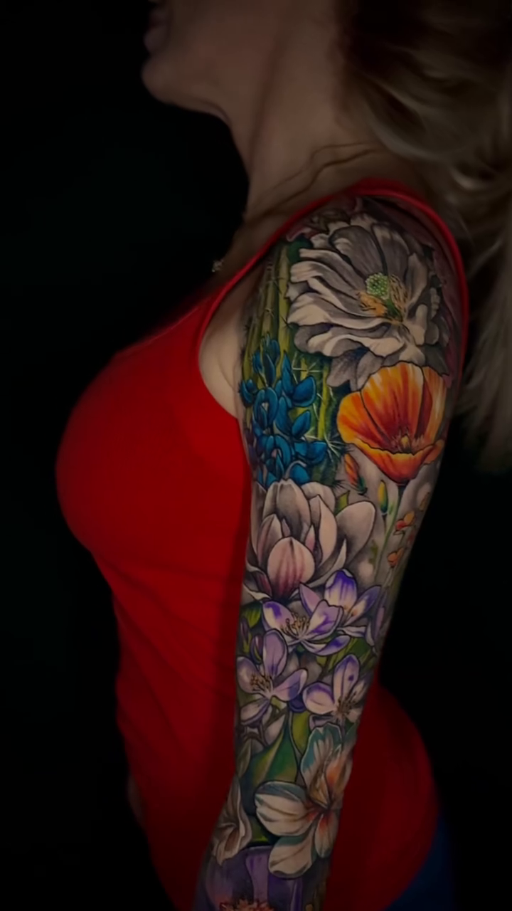 Floral sleeve realism tattoo by Michael brown