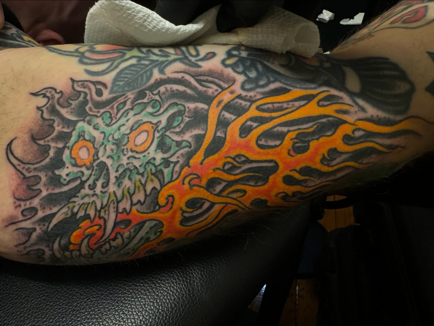 Flame and skull new school tattoo on the forearm by J Ranno, Richmond, Virginia