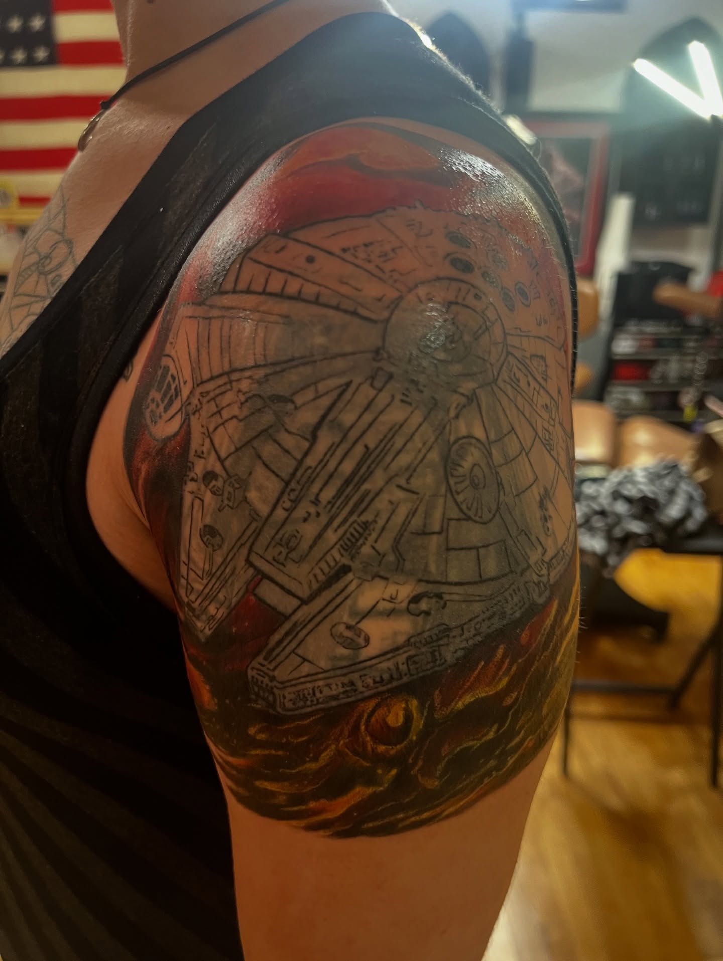 Millennium falcon realism tattoo on the shoulder by steven