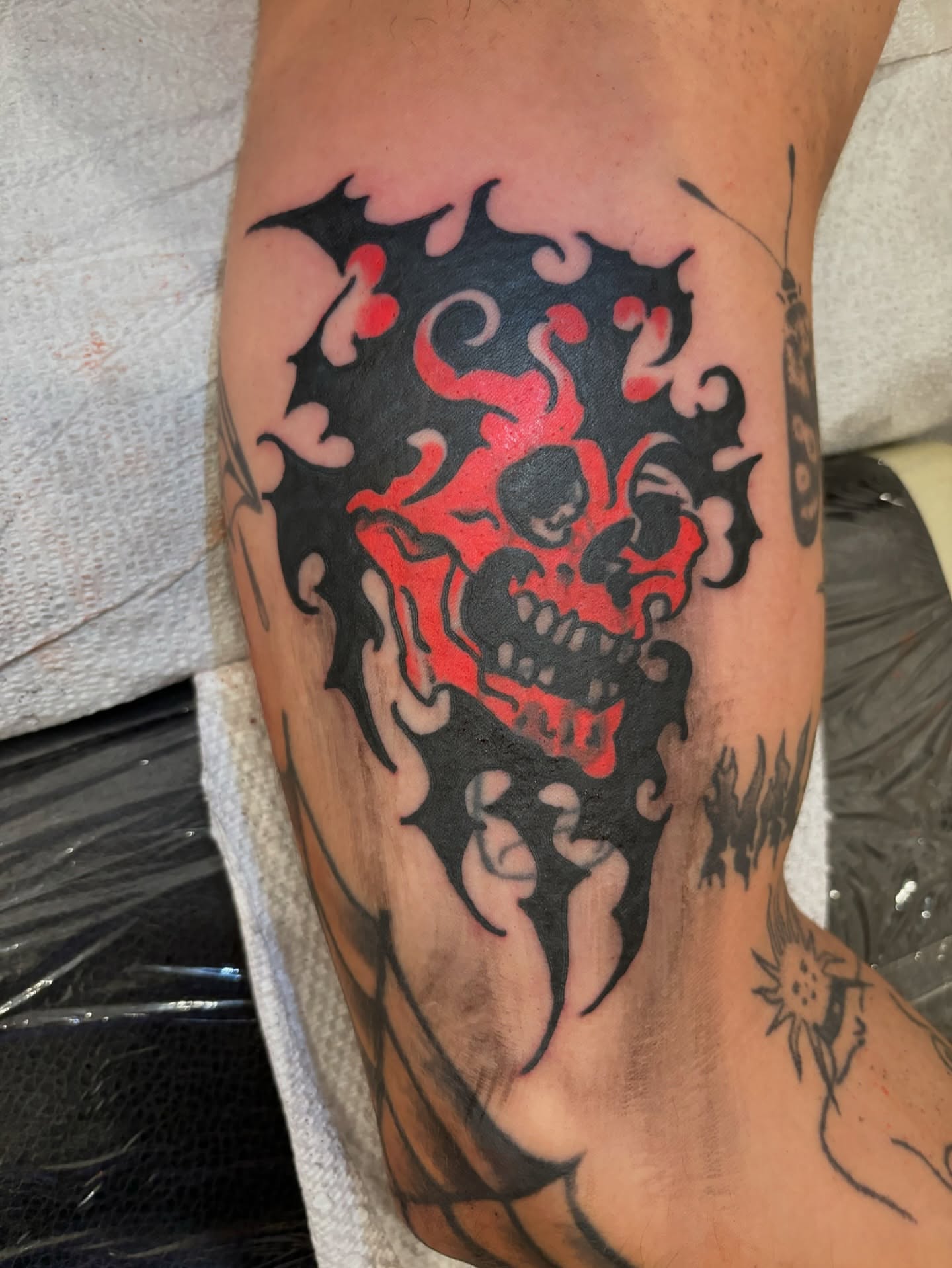Flaming skull American traditional tattoo on the forearm by Francis Cassidy