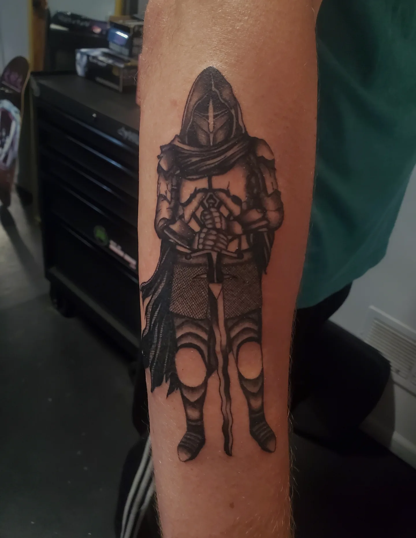 Hooded knight black and grey tattoo on the forearm by Shailey Pasquale