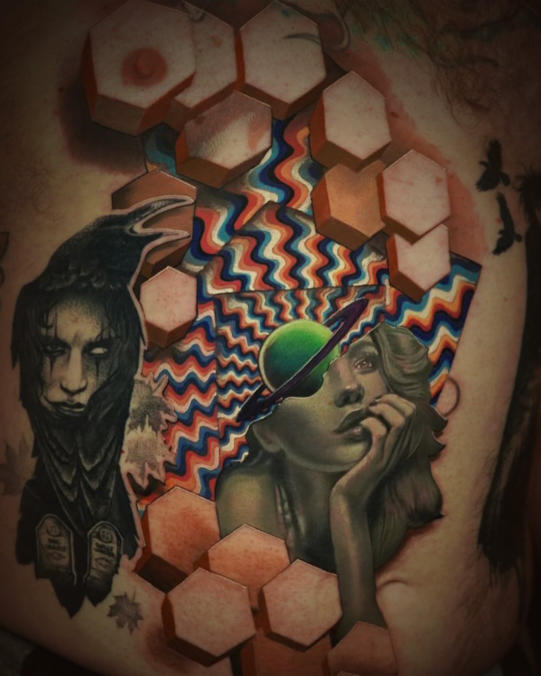 Abstract surrealism surrealism tattoo on the upper arm by Jesse Rix
