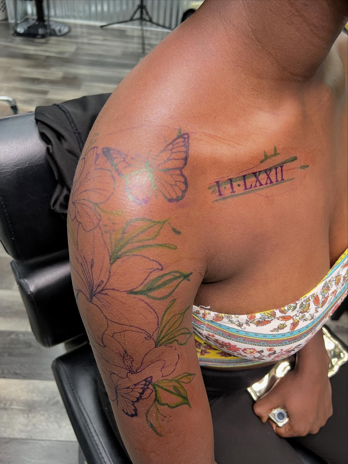 Butterflies and flowers American traditional tattoo on the shoulder by Monii Arreola