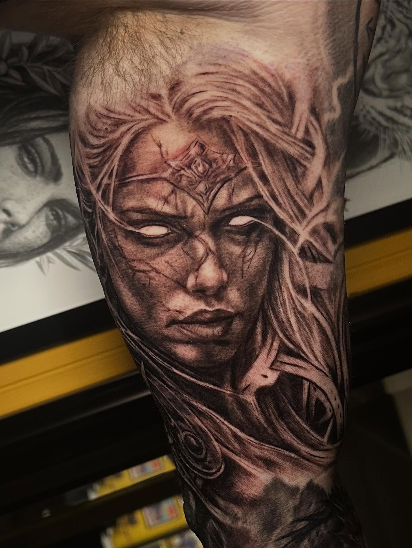 Woman's face realism tattoo on the forearm by Comfy Chris Fettig