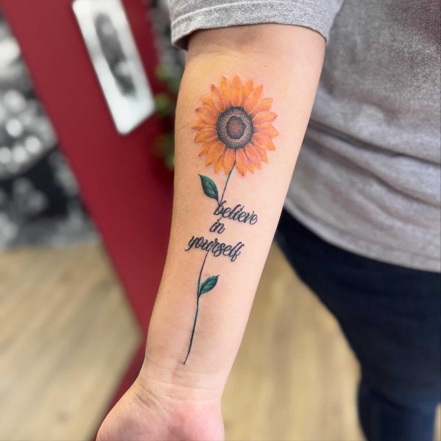 Sunflower realism tattoo on the forearm by Robbie Bryant