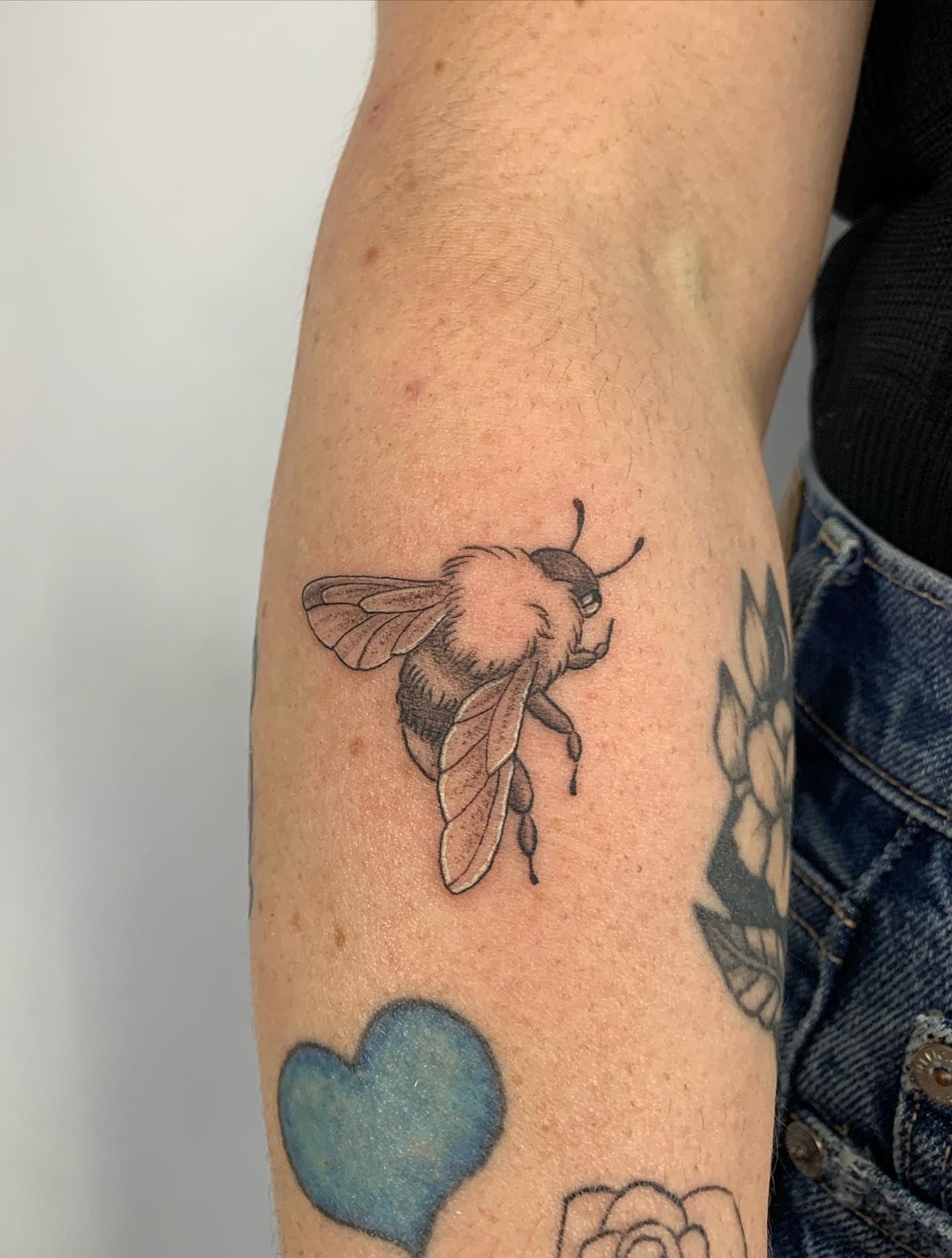 Bee black and grey tattoo on the forearm by ⊹ Avery Peterson ⊹