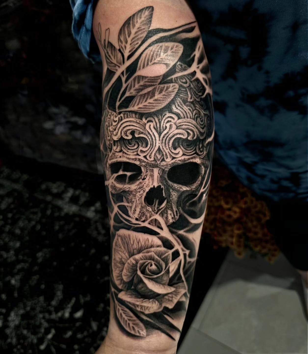 Skull and rose realism tattoo on the forearm by Julia Oravets