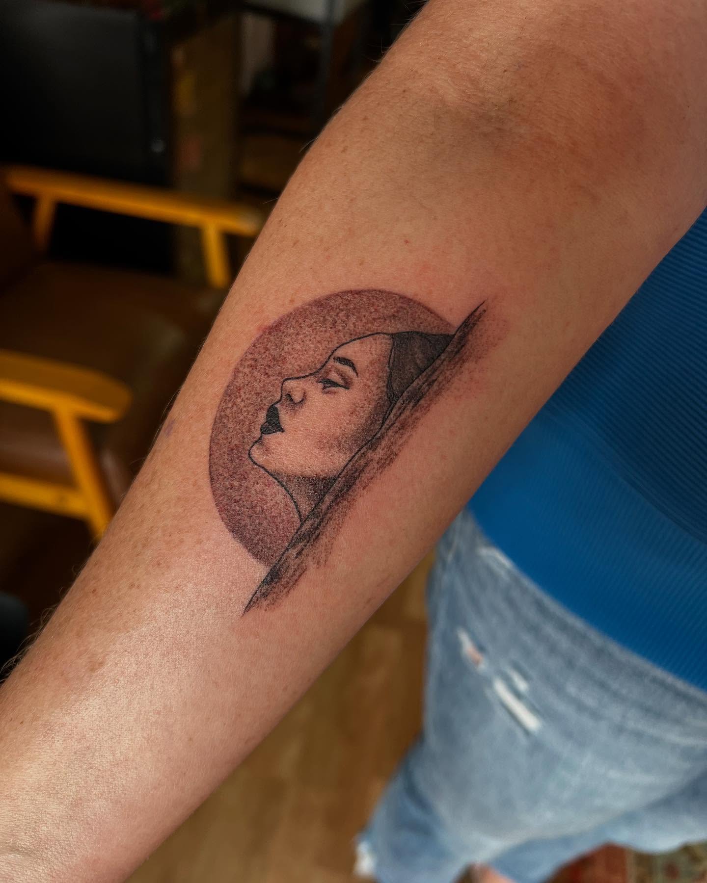 Woman's profile dotwork tattoo on the forearm by Taya Lynn, Hudson, Wisconsin