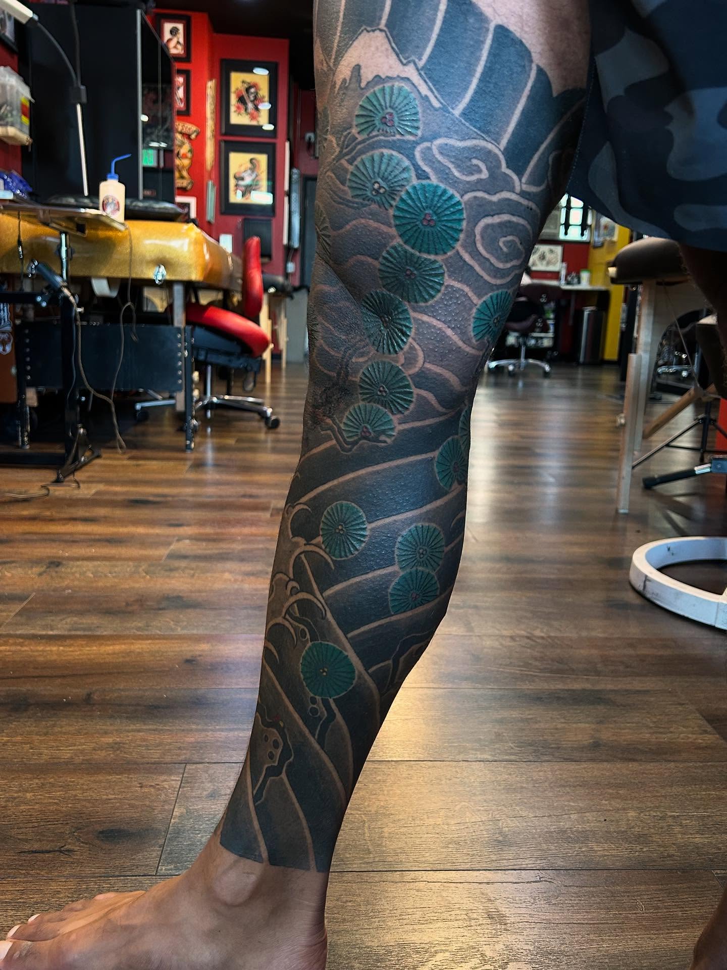 Seaweed and waves japanese irezumi tattoo on the leg by Tako, Seattle, Washington