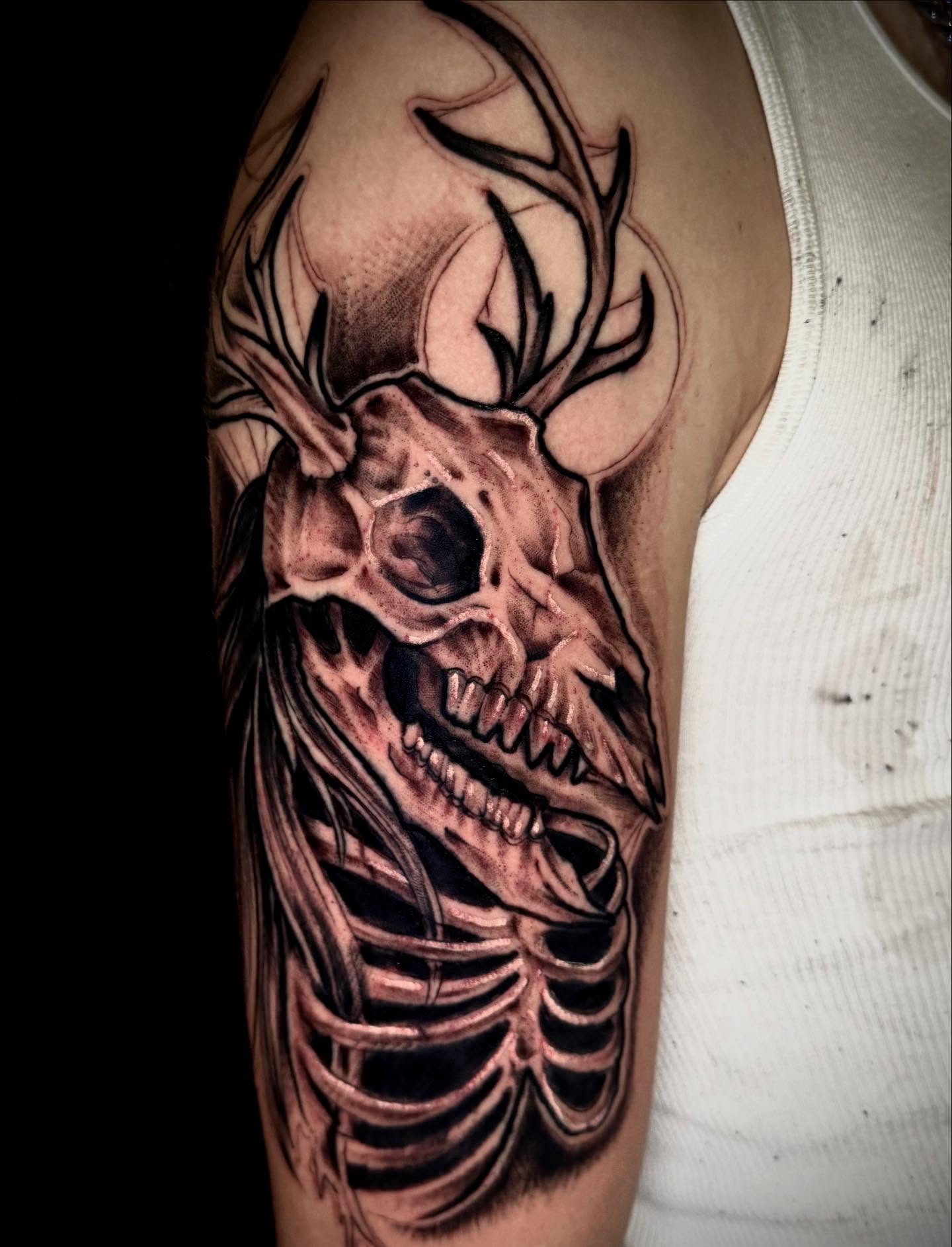 Deer skull realism tattoo on the forearm by Thomas Martinez