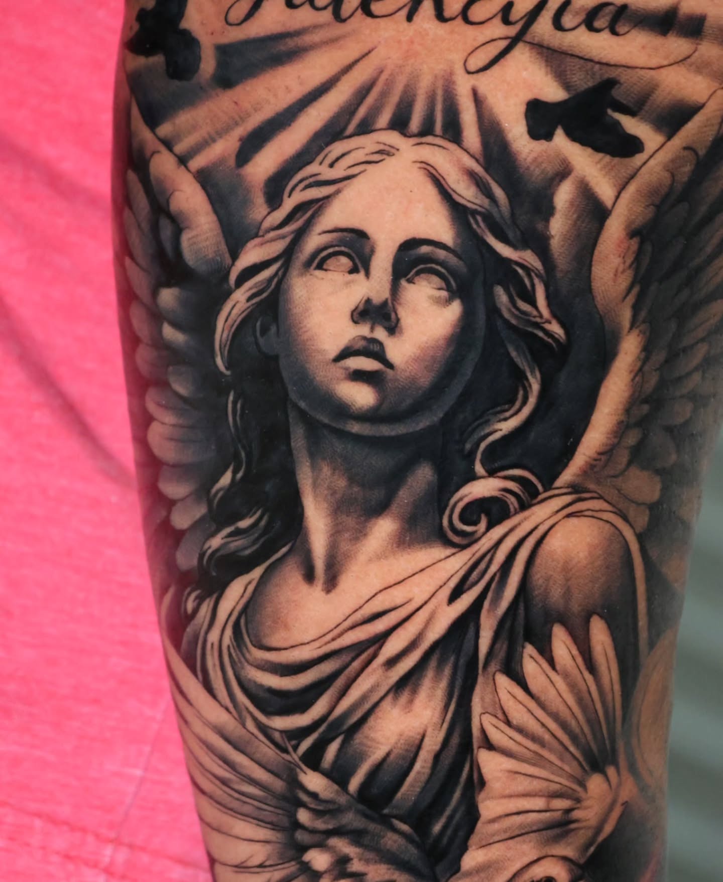 Angel realism tattoo on the forearm by Jesus Bravo