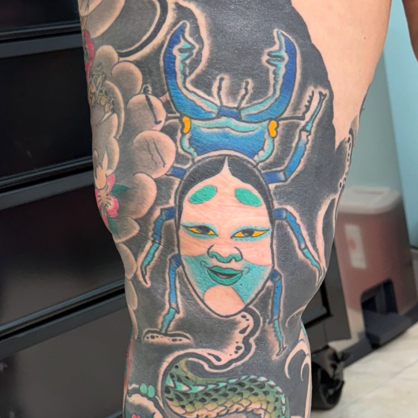 Woman with headdress American traditional tattoo on the thigh by DemianThompson