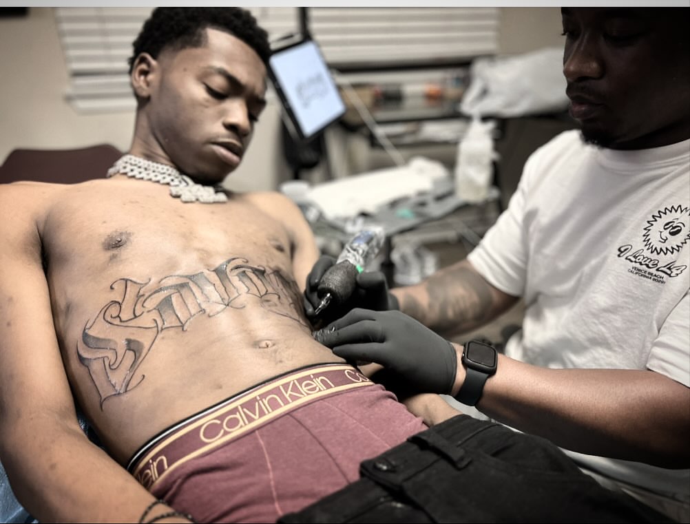 Script lettering lettering script tattoo on the chest by Jared McGee