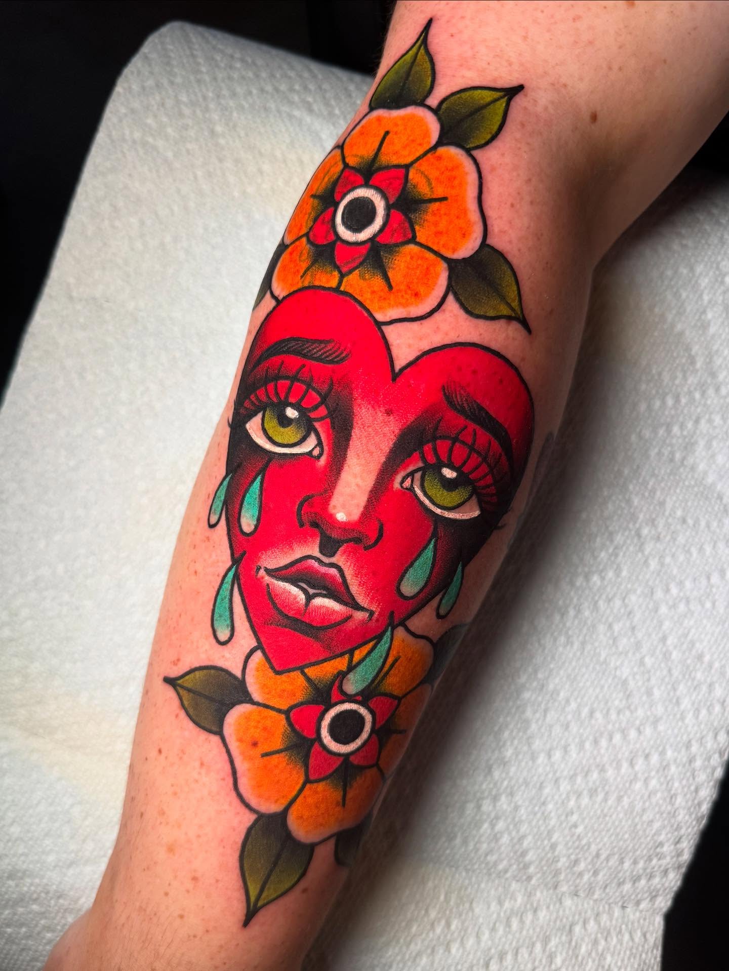Woman's face American traditional tattoo on the forearm by Jess Longfield, Des Moines, Iowa