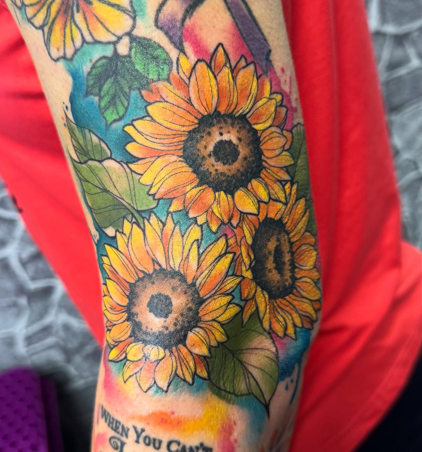 Sunflowers watercolor tattoo on the forearm by Bri