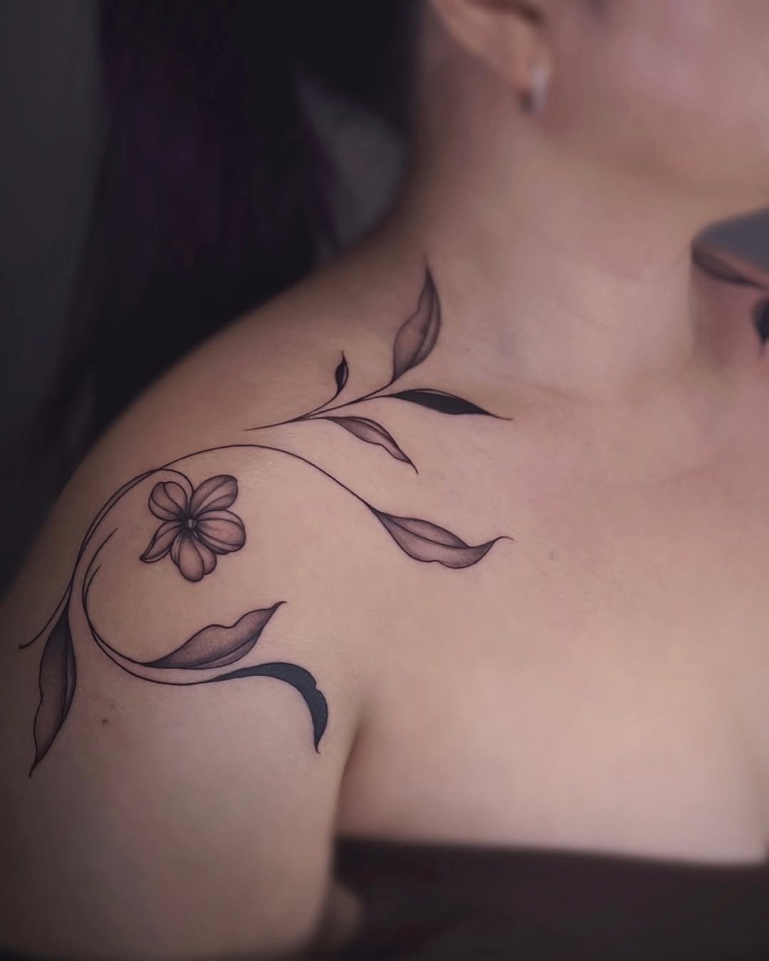 Floral vine fine line tattoo on the shoulder by IVY