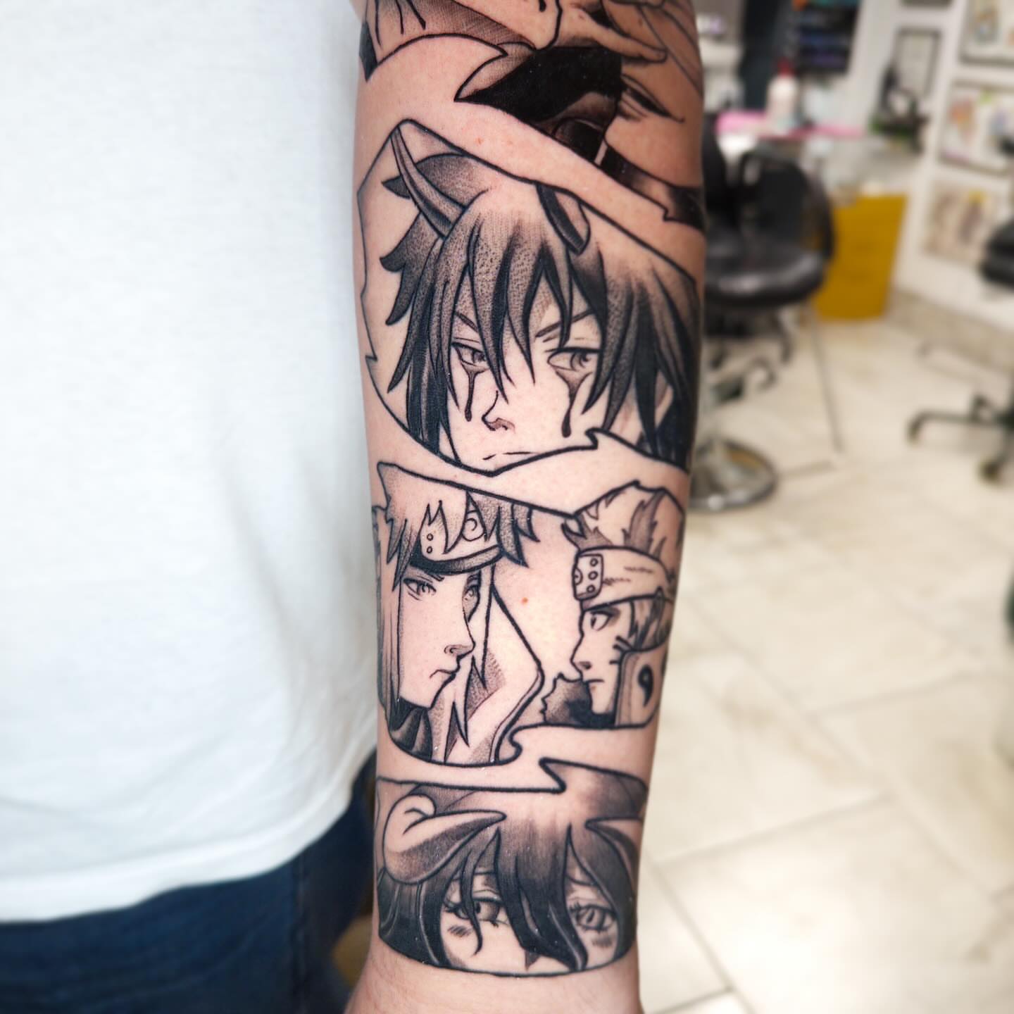 Anime characters anime tattoo on the forearm by John Milosh Chamberlin
