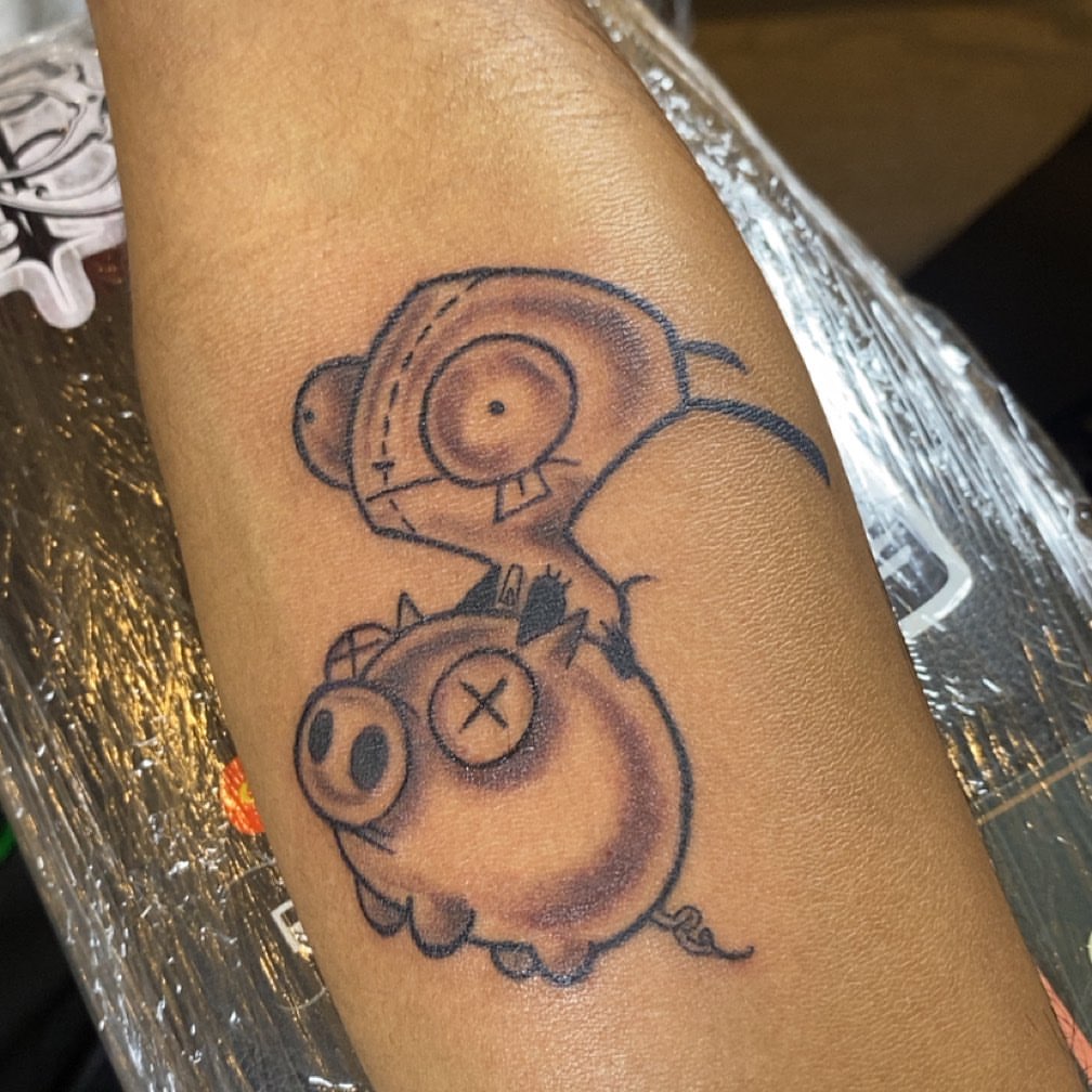 Pig and owl black and grey tattoo on the forearm by Tattsruru