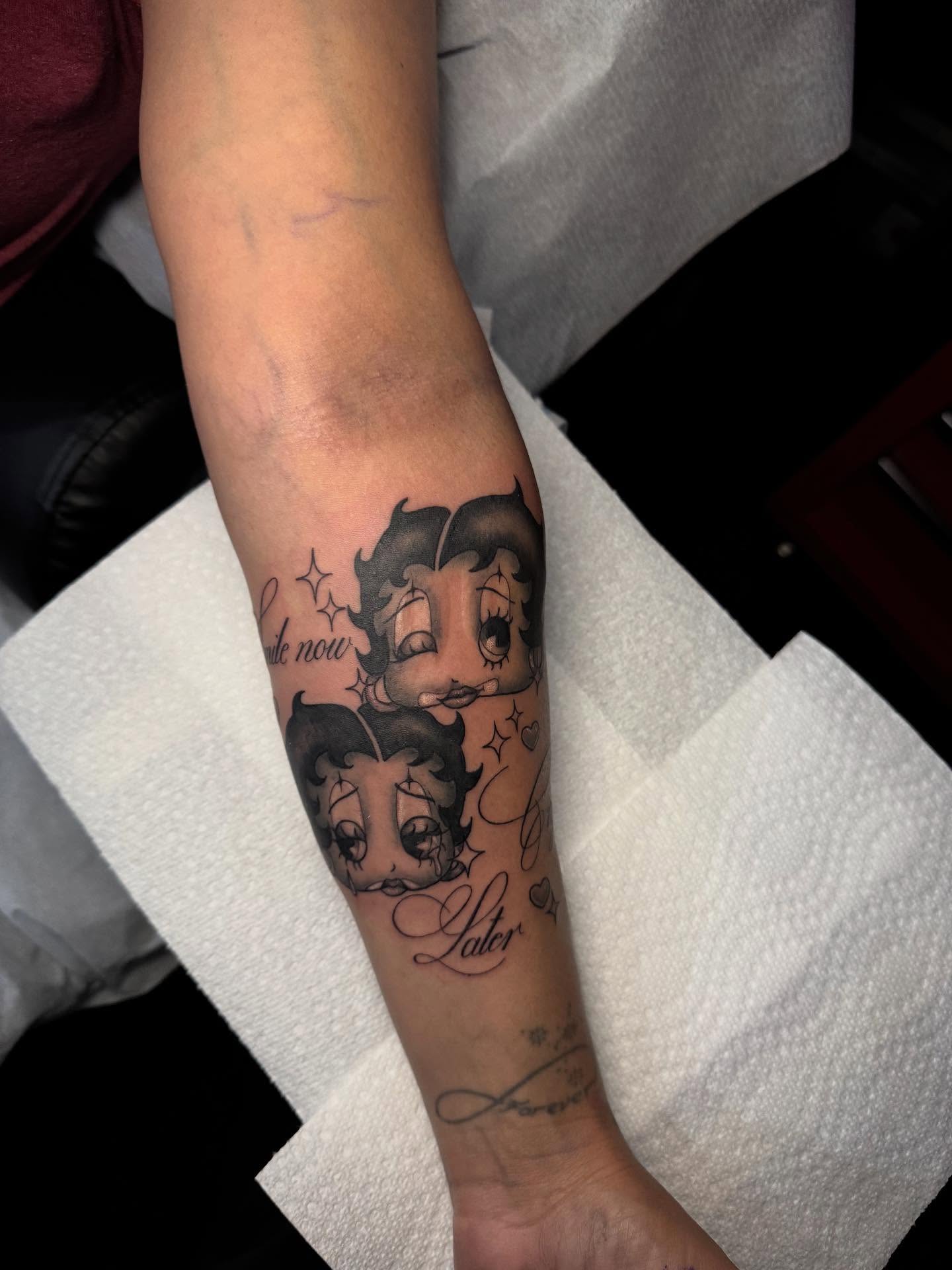 Betty Boop black and grey tattoo on the forearm by Nathalie Briseno