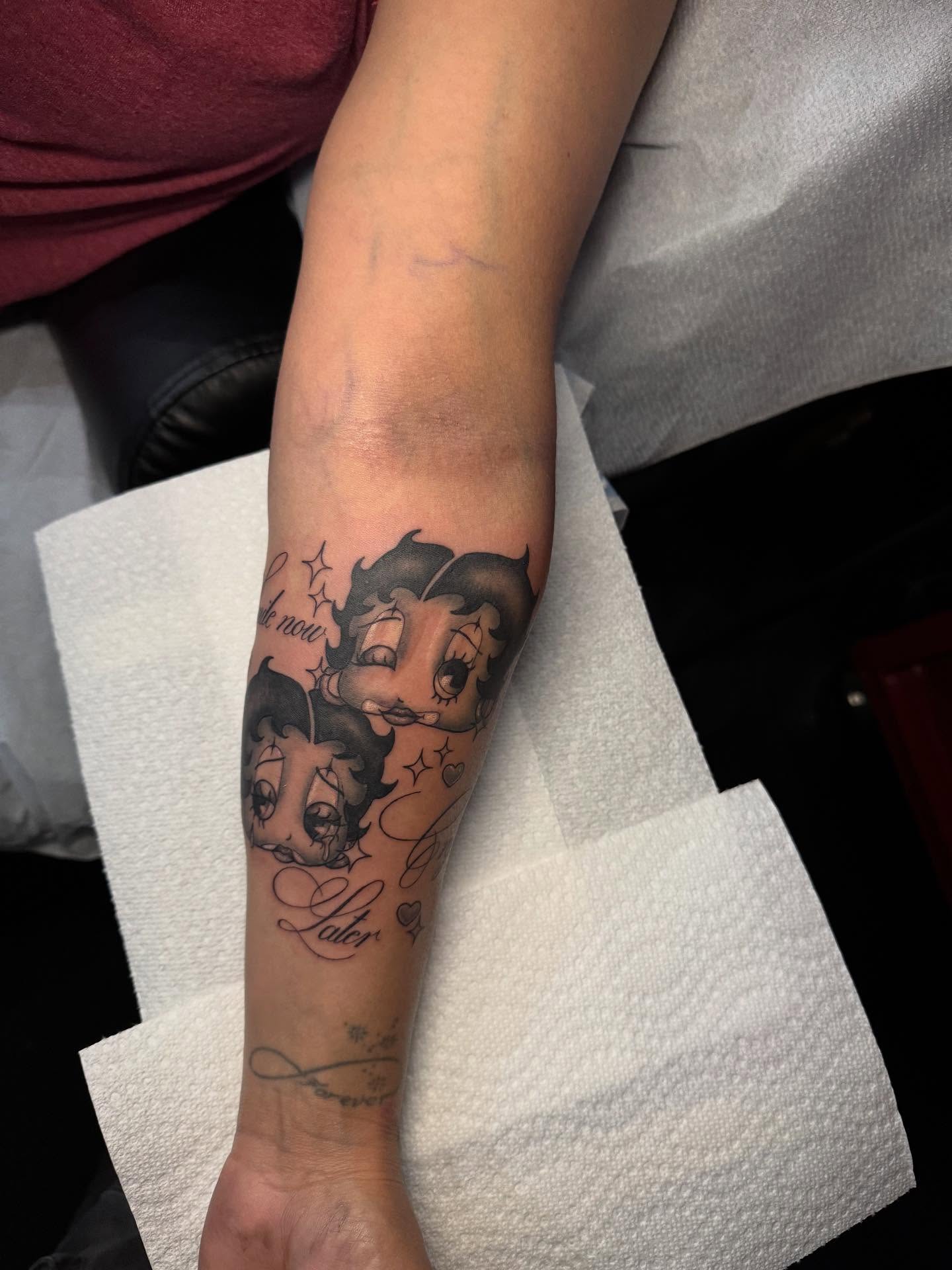 Betty Boop black and grey tattoo on the forearm by Nathalie Briseno