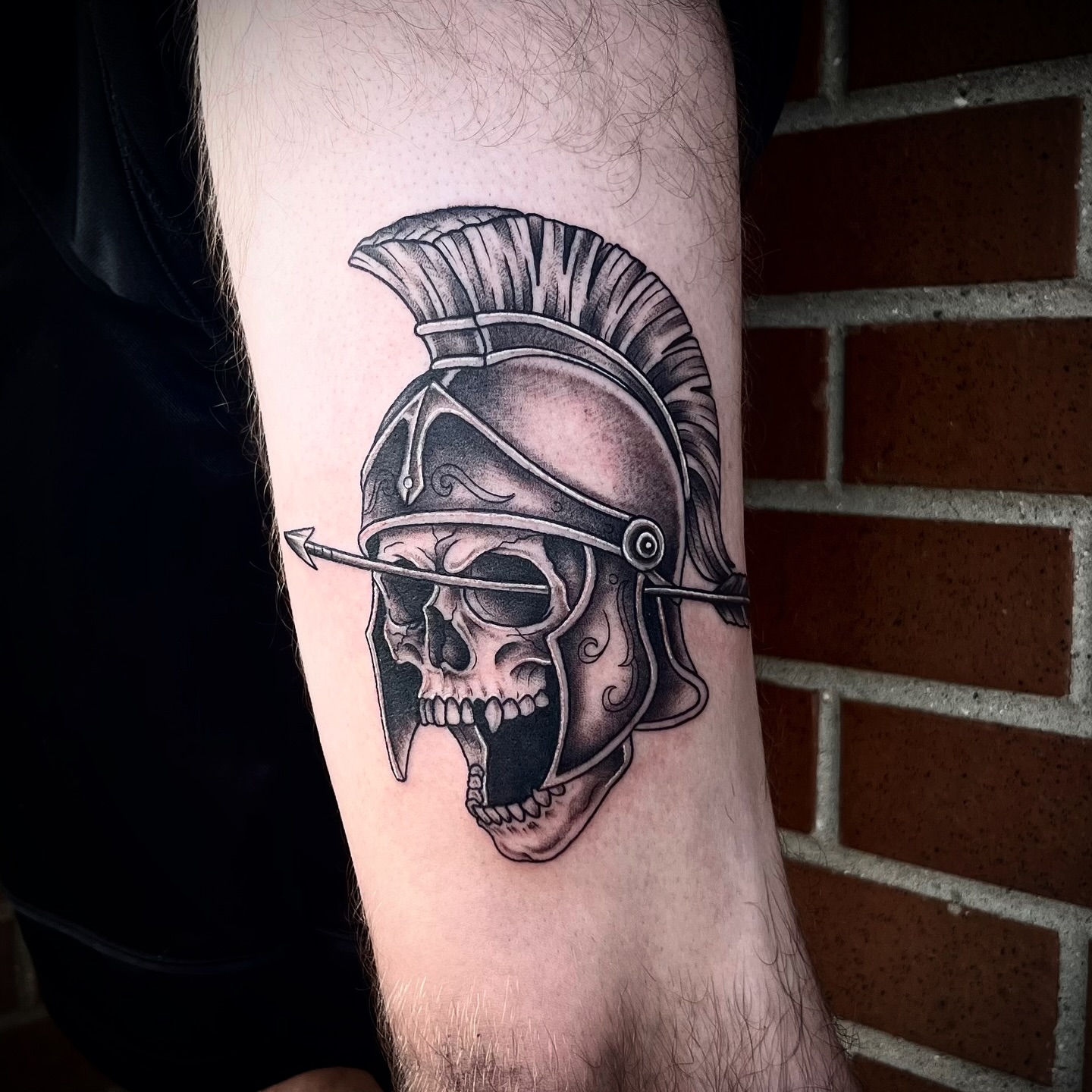 Roman helmet skull realism tattoo on the forearm by Lauren Dempsey, Dearborn, Michigan