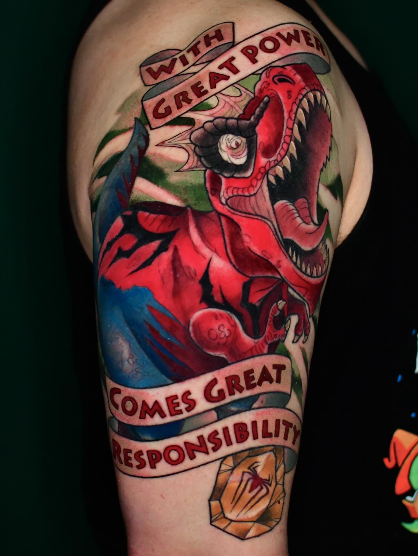 T-Rex American traditional tattoo on the upper arm by Karina πΌ Orange County Tattoo Artist