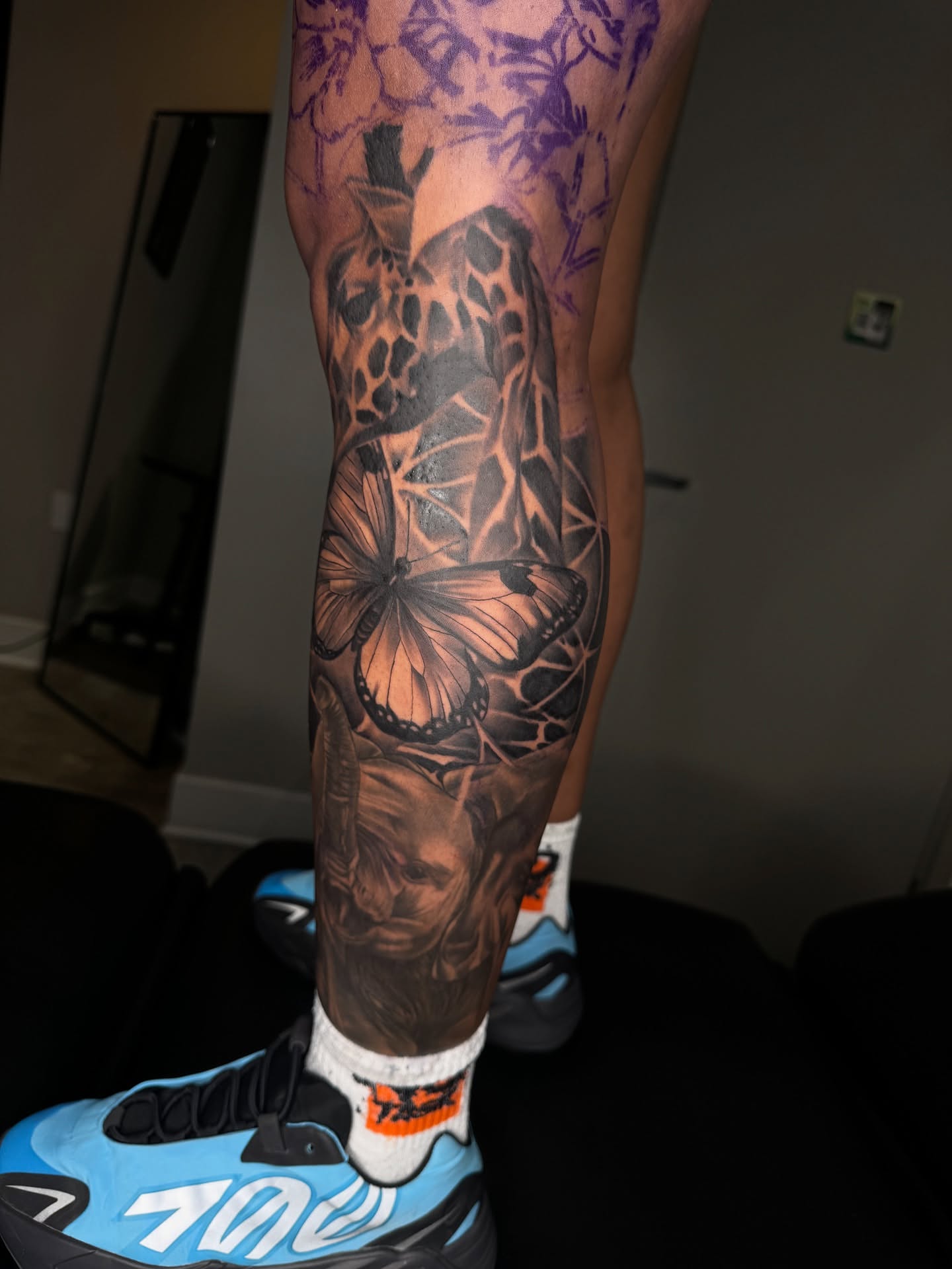 Butterfly and skull realism tattoo on the calf by Visionary🌌