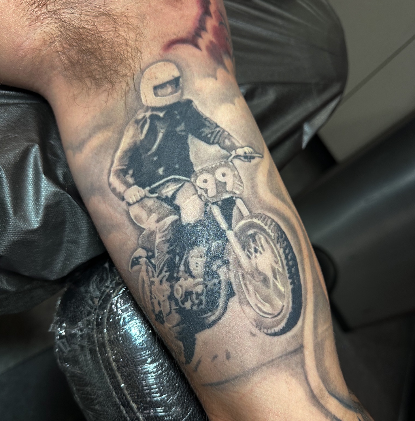 Motorcycle rider realism tattoo on the forearm by las vegas tattoo artist