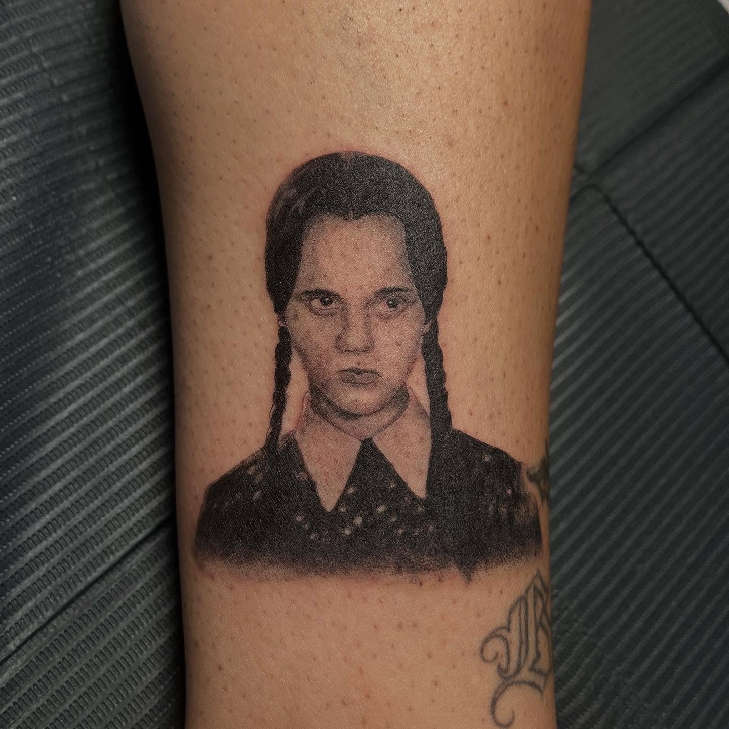 Wednesday Addams realism tattoo on the forearm by San Diego tattoo artist