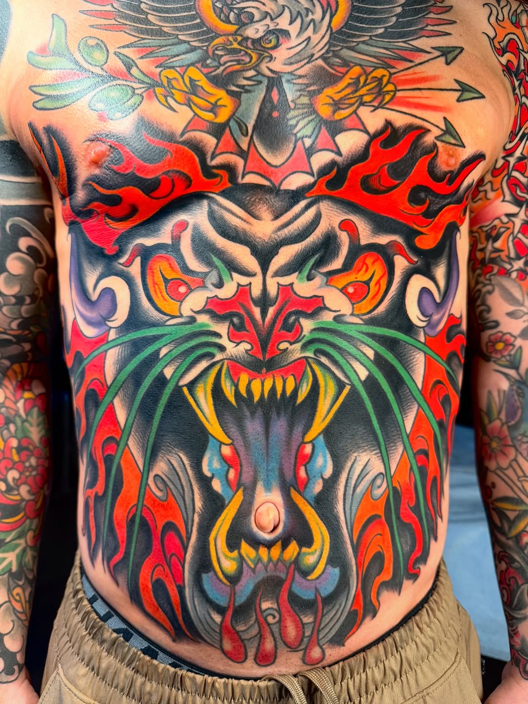 Dragon and eagle Japanese tattoo on the torso by sydtatz