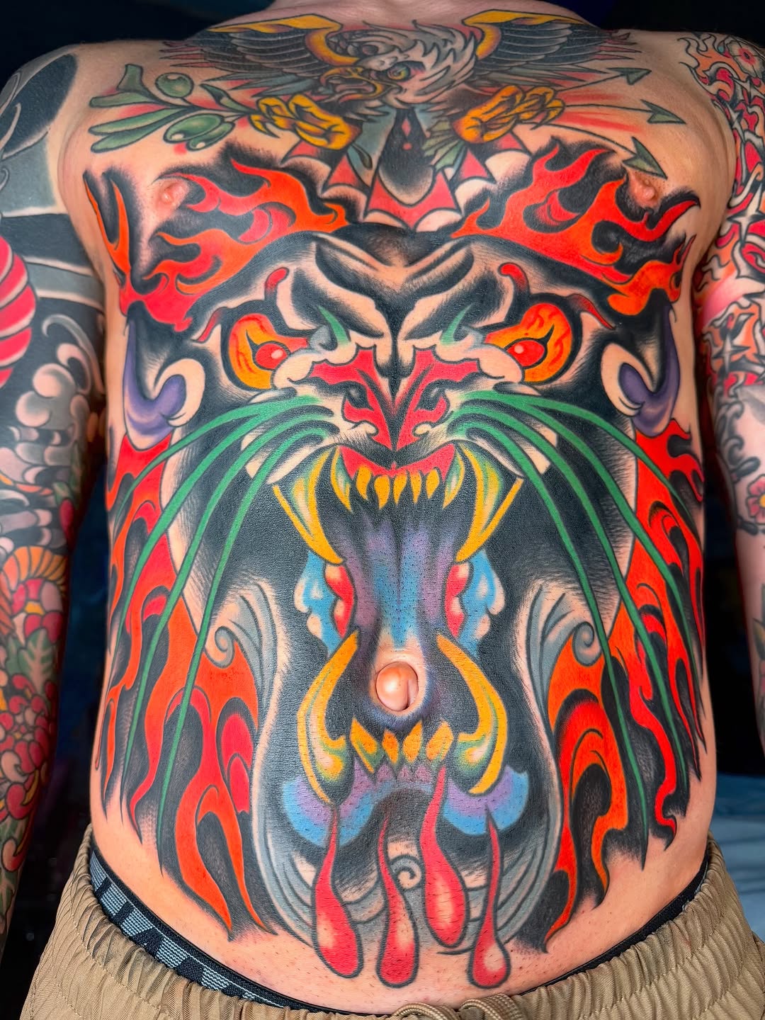 Dragon and flames ignorant tattoo on the back by sydtatz