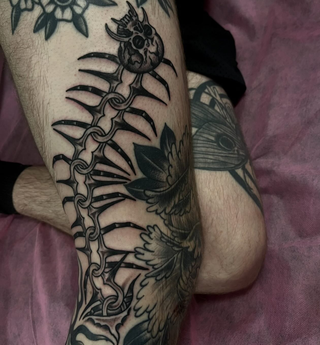 Spine and skull geometric tattoo on the forearm by Lee Brewster, Erlanger, Kentucky