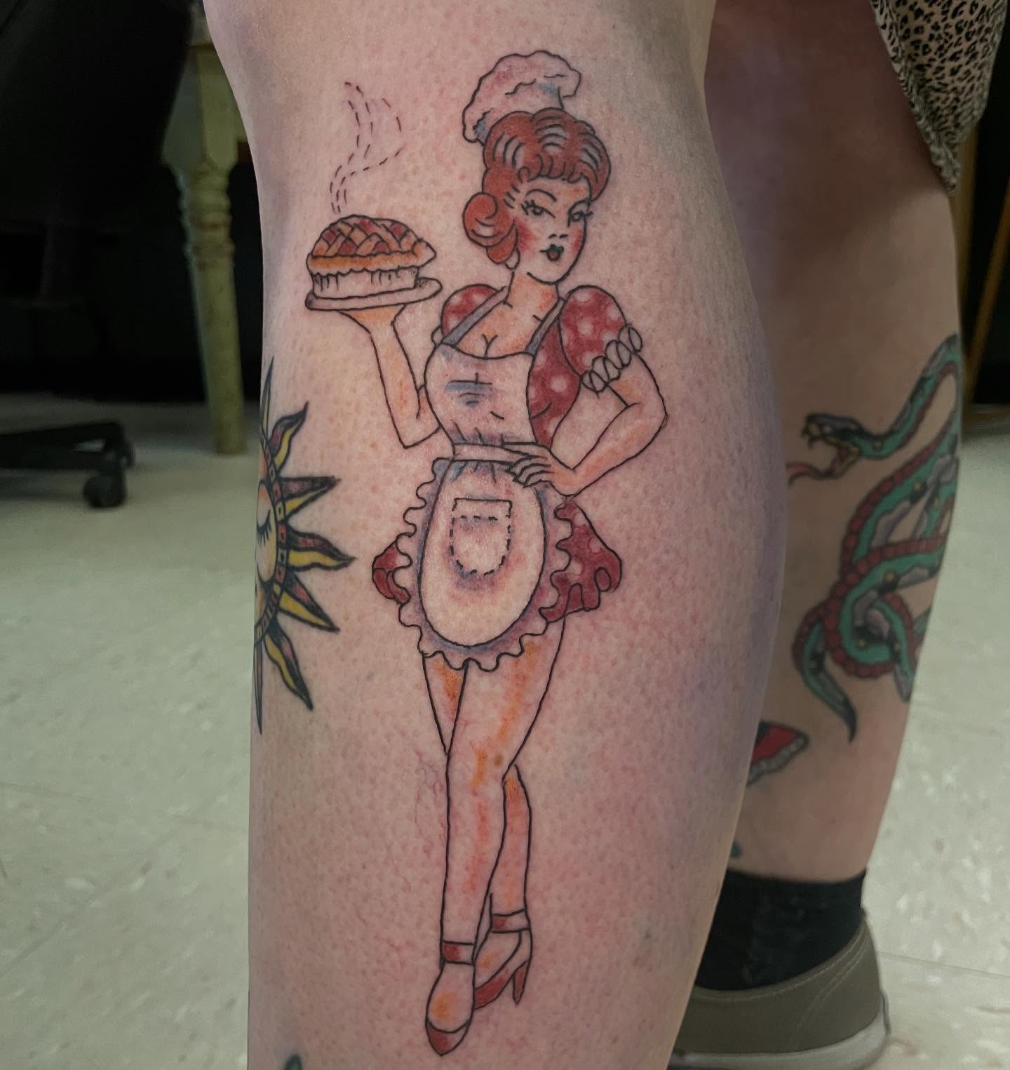 Chef holding pie American traditional tattoo on the thigh by Logan Casimir