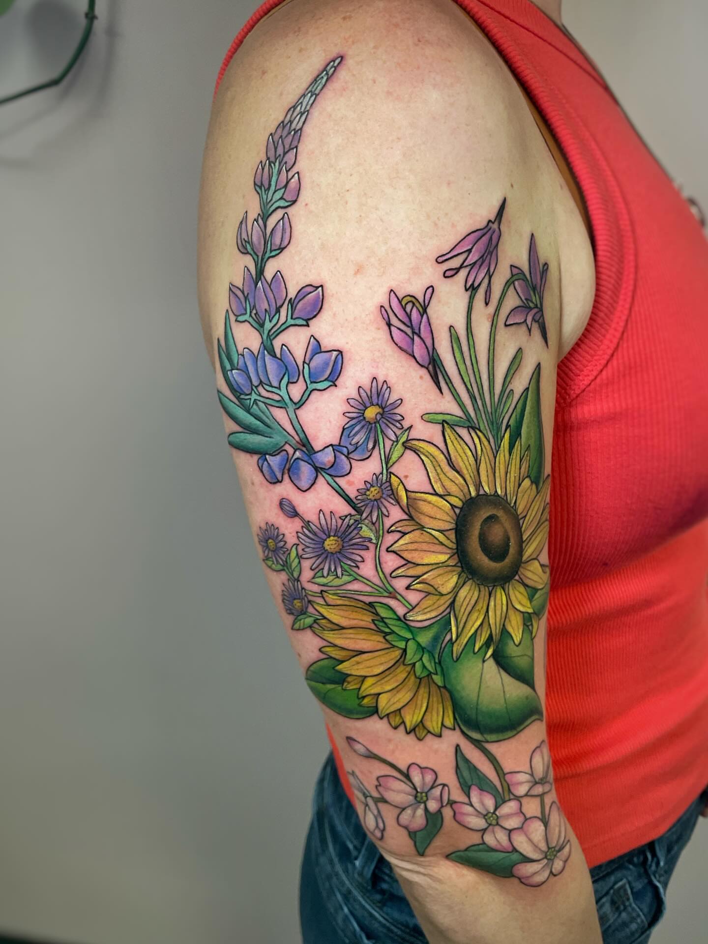Wildflowers new school tattoo on the upper arm by Michelle Pomerantz 🌼 Portland Tattoo Artist