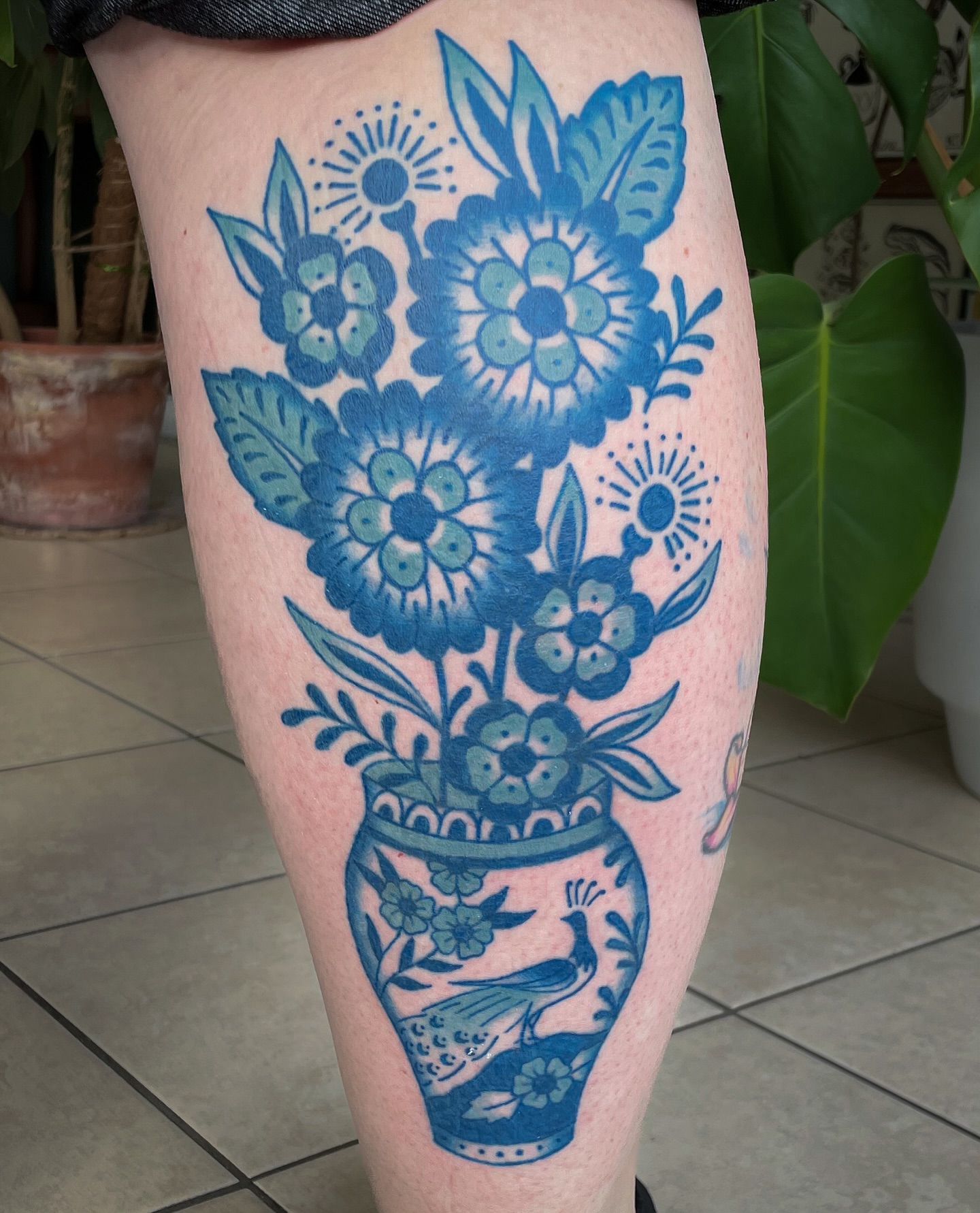 Floral arrangement ornamental tattoo on the leg by Jessica Oram Brockman, Dayton, Ohio