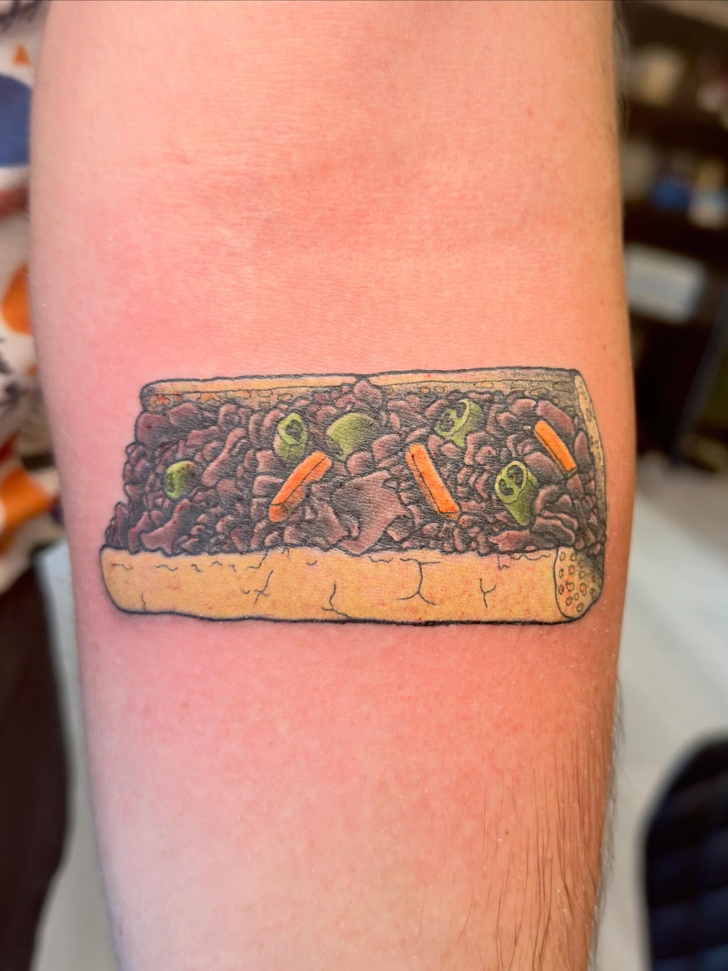Sandwich realism tattoo on the forearm by Patrick Carroll
