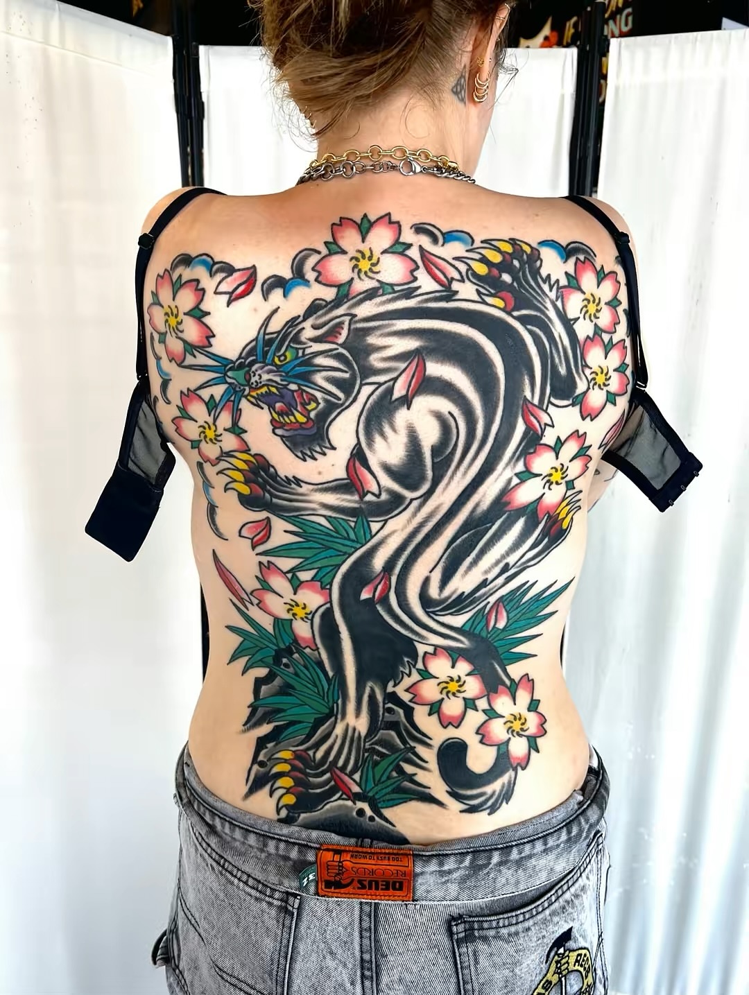 Dragon and cherry blossoms American traditional tattoo on the back by Nestor Zelaya