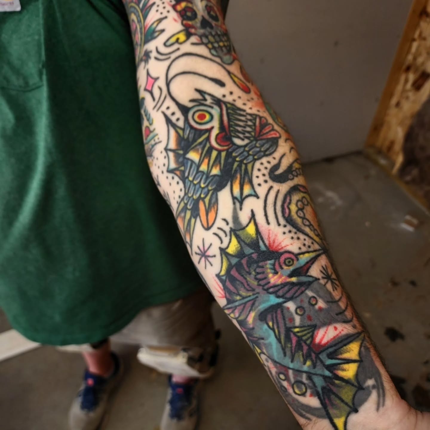 Dragon and bird American traditional tattoo on the forearm by Mitch Braver