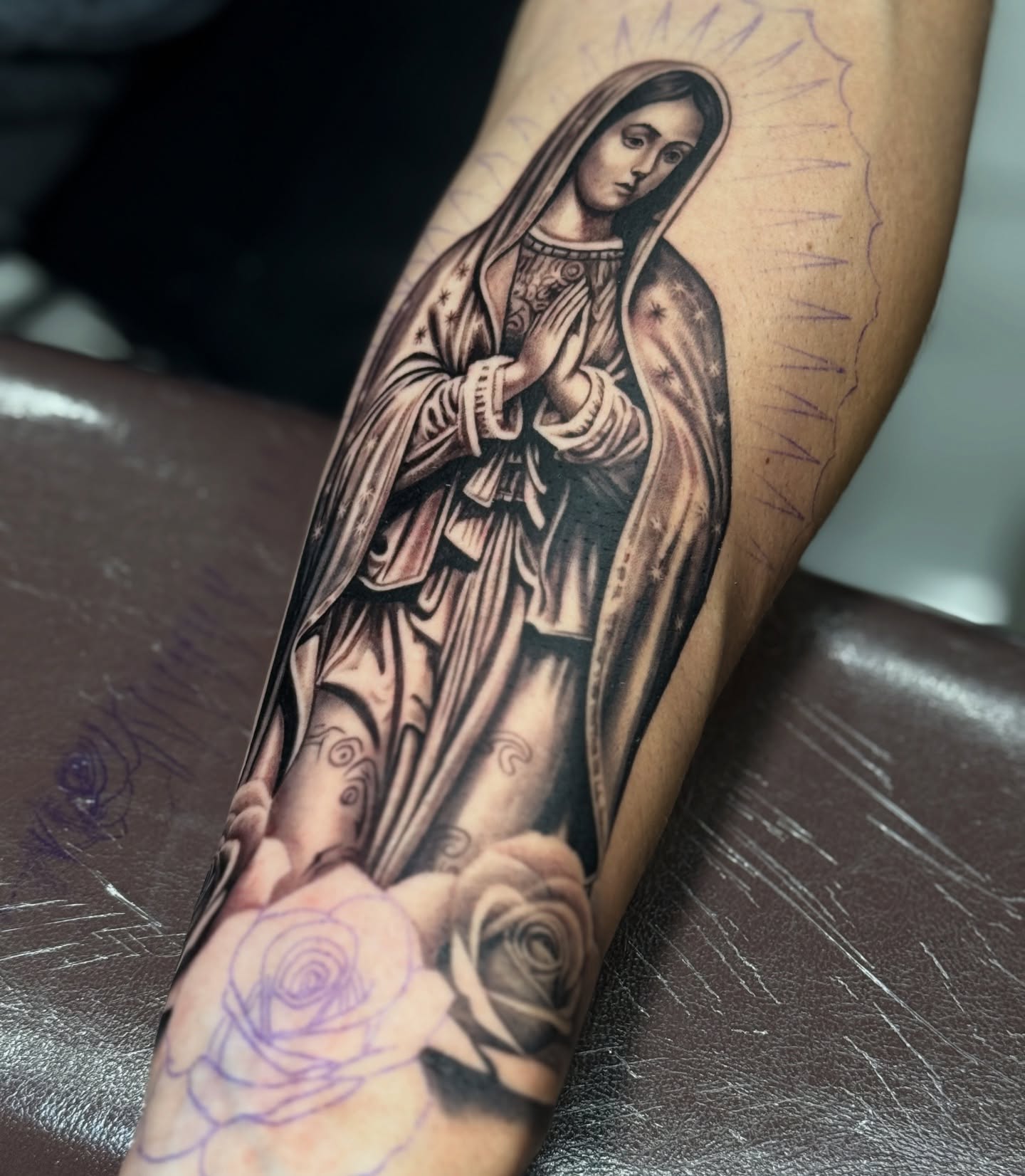 Virgin mary black and grey tattoo on the forearm by Sergio Mendez