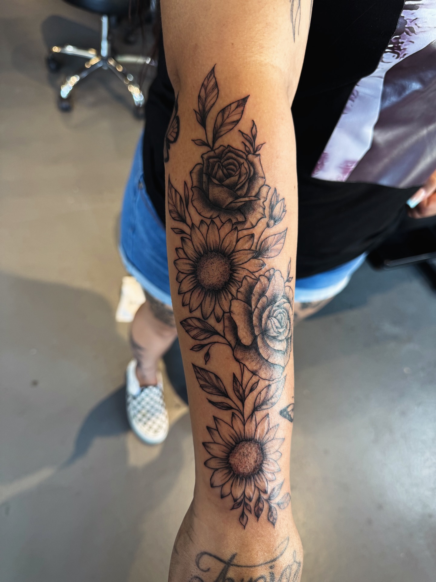 Sunflowers and roses black and grey tattoo on the forearm by @inkspirationtattoo_co