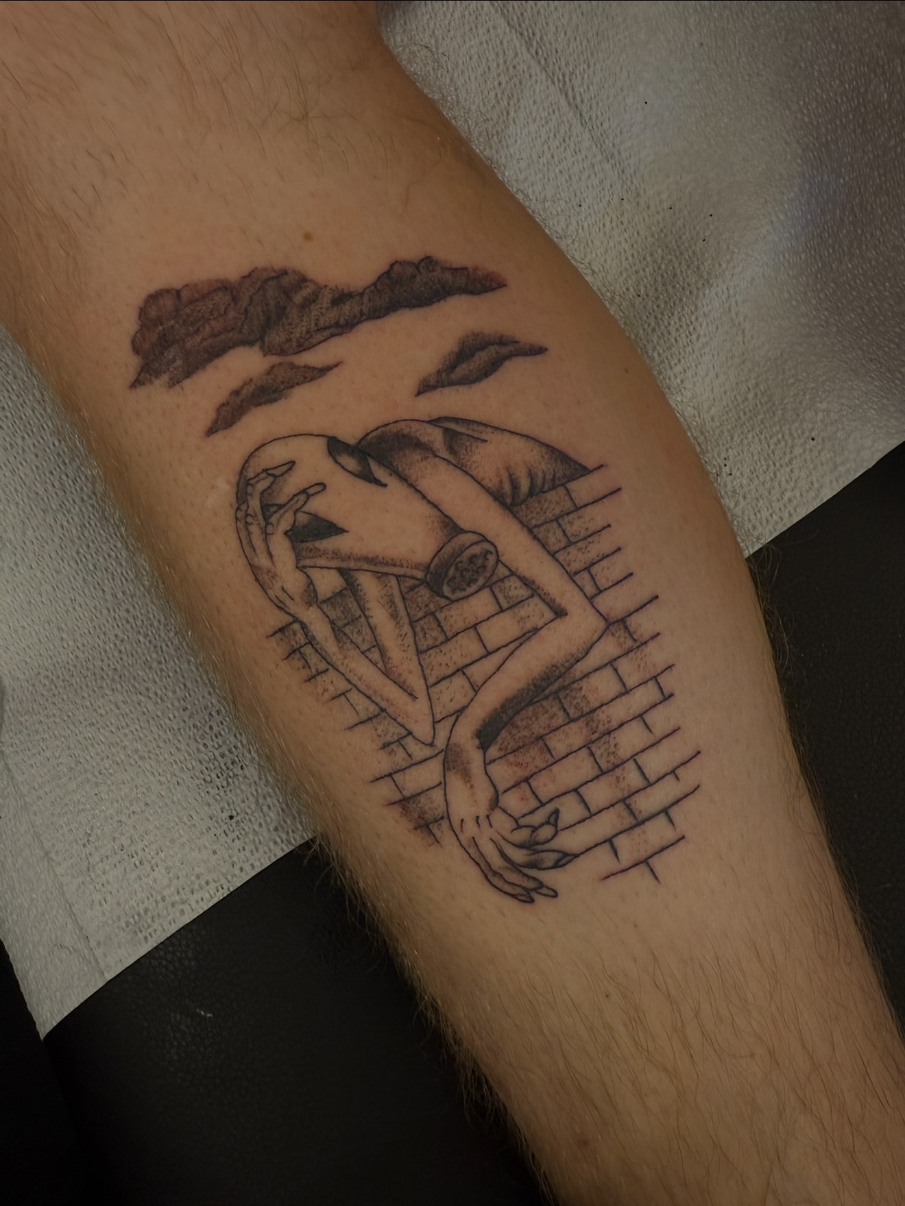 Woman climbing brick wall neo-traditional tattoo on the forearm by Zac Clark