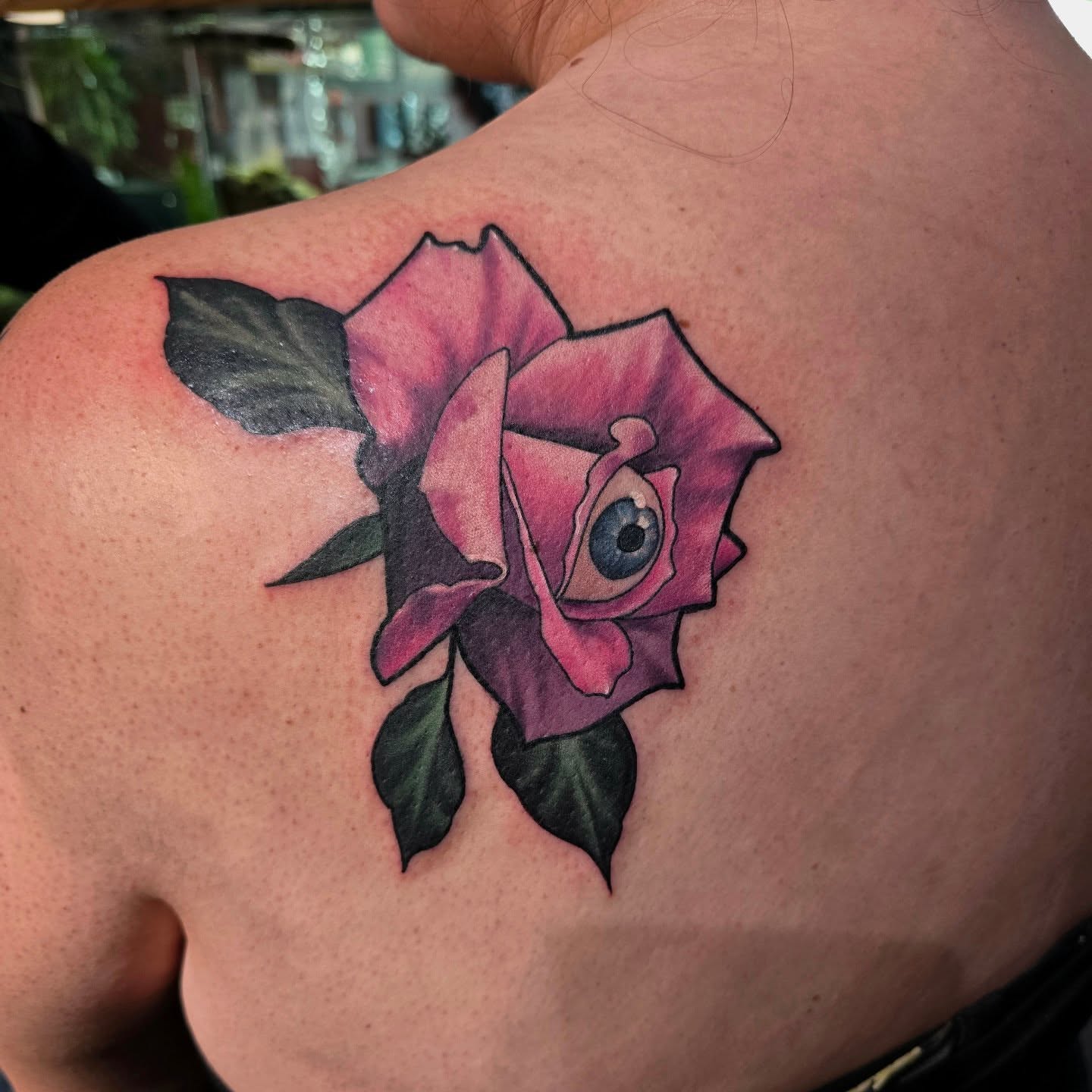Rose with eye realism tattoo on the shoulder by Gabrielle Nicole Soucie