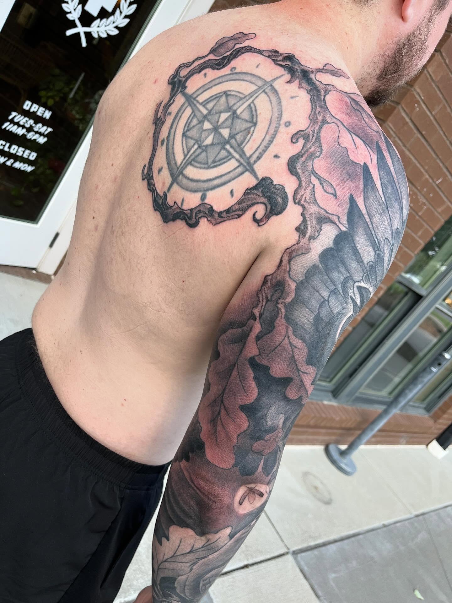 Compass black and grey tattoo on the shoulder by Ian White