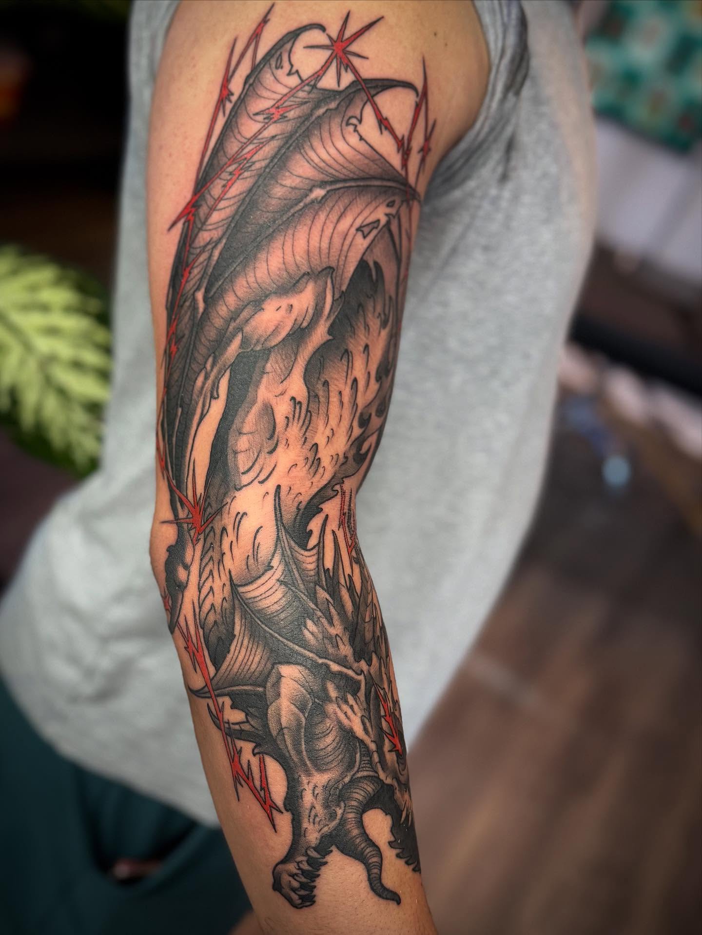Dragon realism tattoo on the forearm by Chase Martines