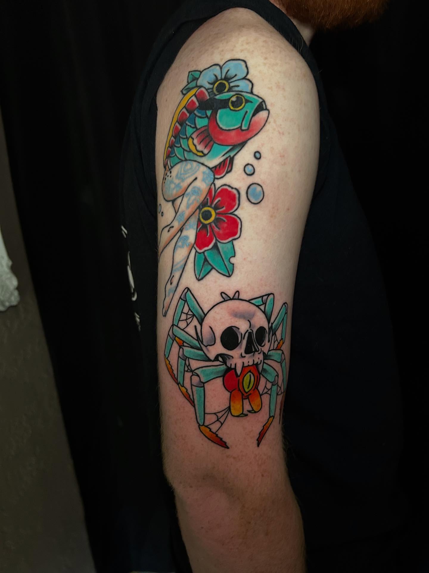 Fish, flower, spider, skull American traditional tattoo on the forearm by Tim Wilson