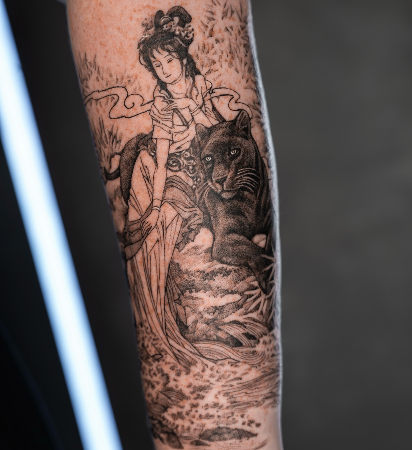 Woman with panther dotwork tattoo on the forearm by Tri