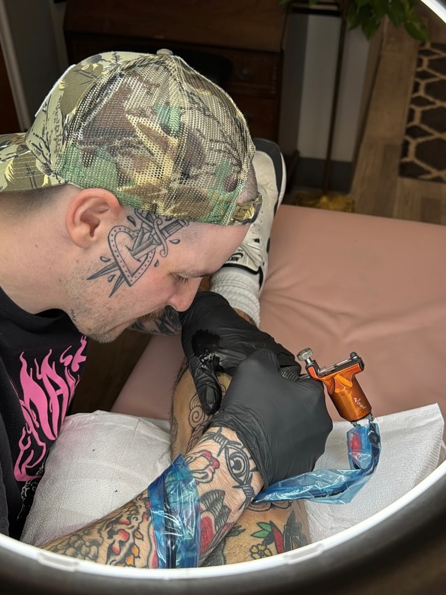 Heart with wings American traditional tattoo on the forearm by Josh Johns