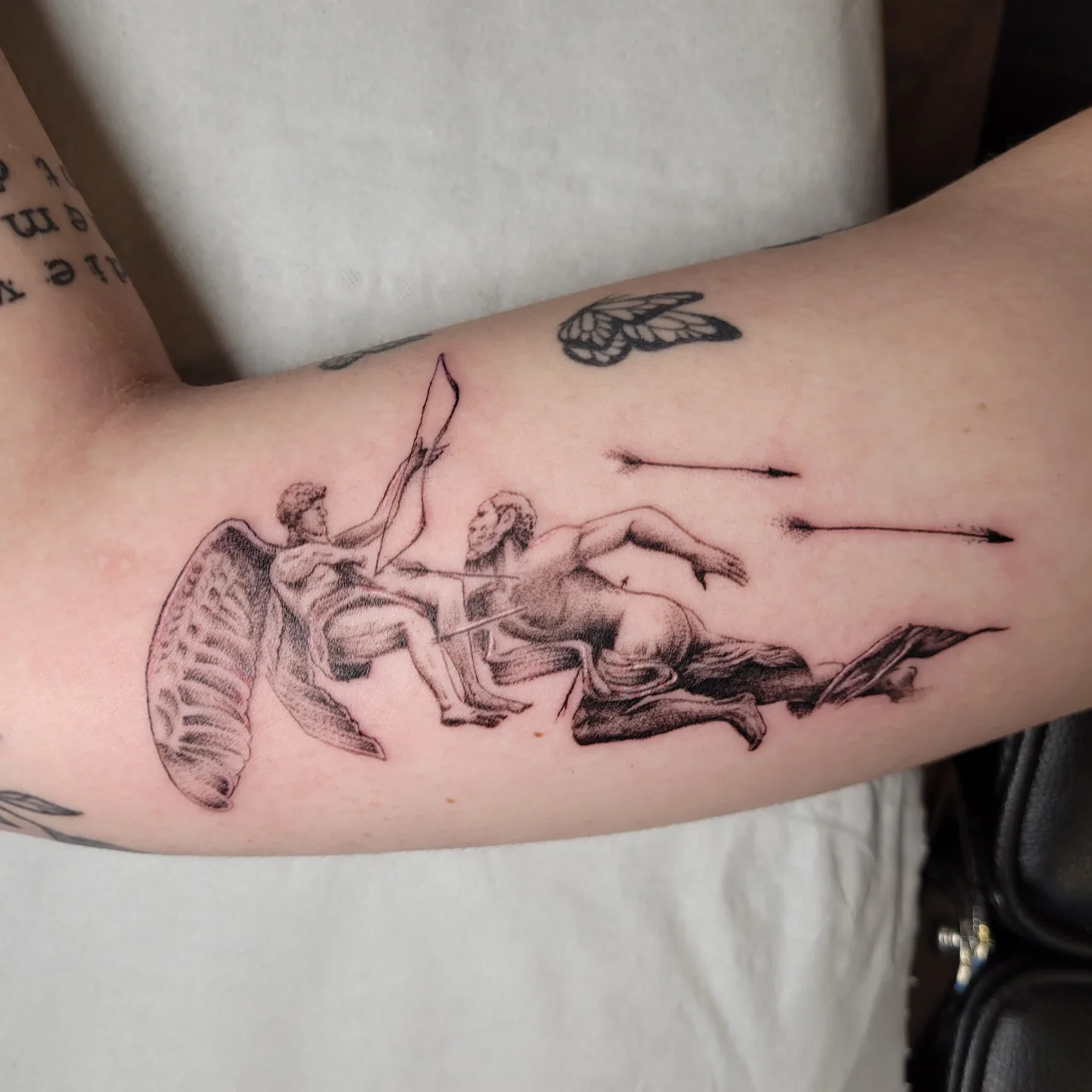 Angel and fallen angel realism tattoo on the forearm by Sooz, Tours, Centre-Val de Loire