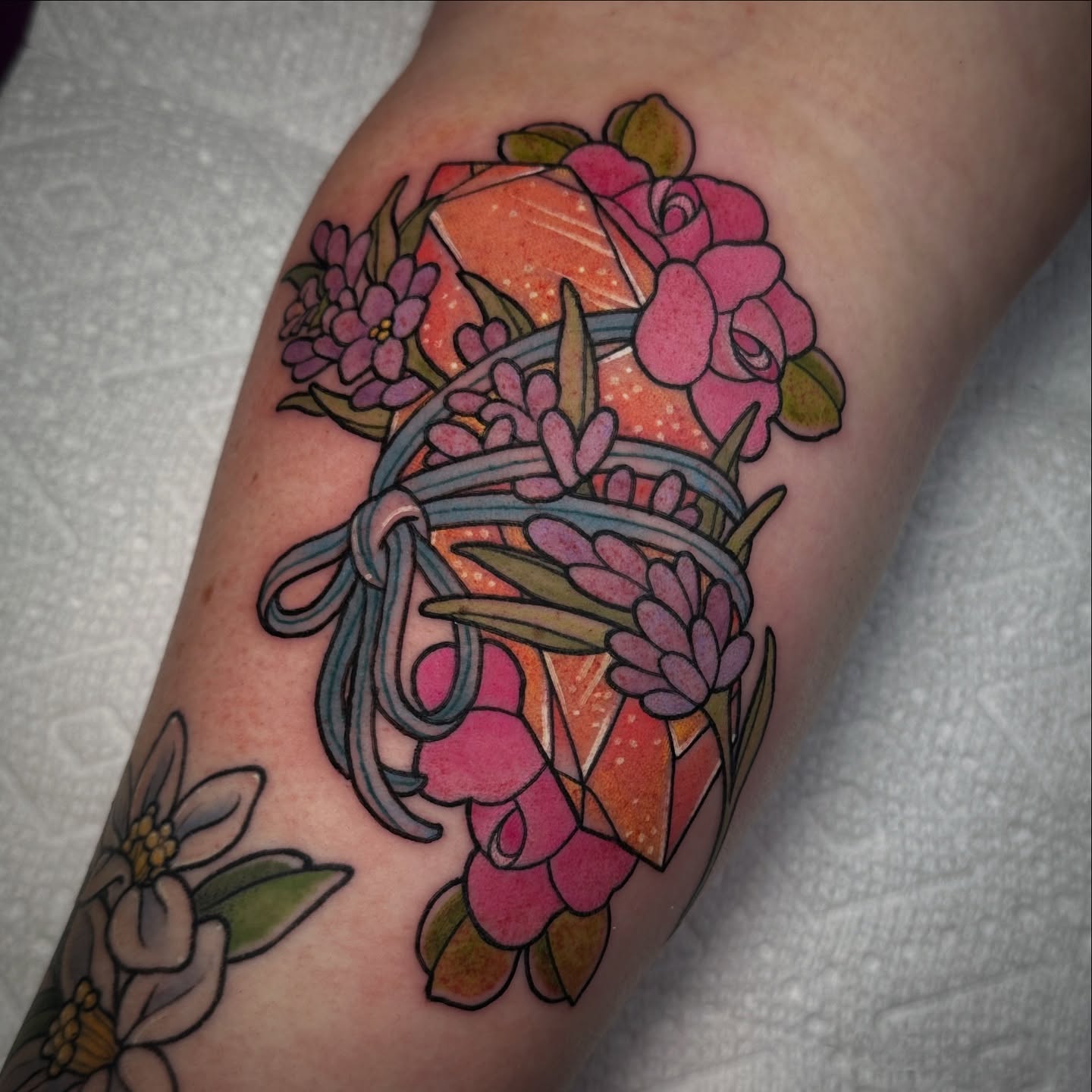 Floral bouquet geometric tattoo on the forearm by Tayler Pearson, Fort Collins, Colorado