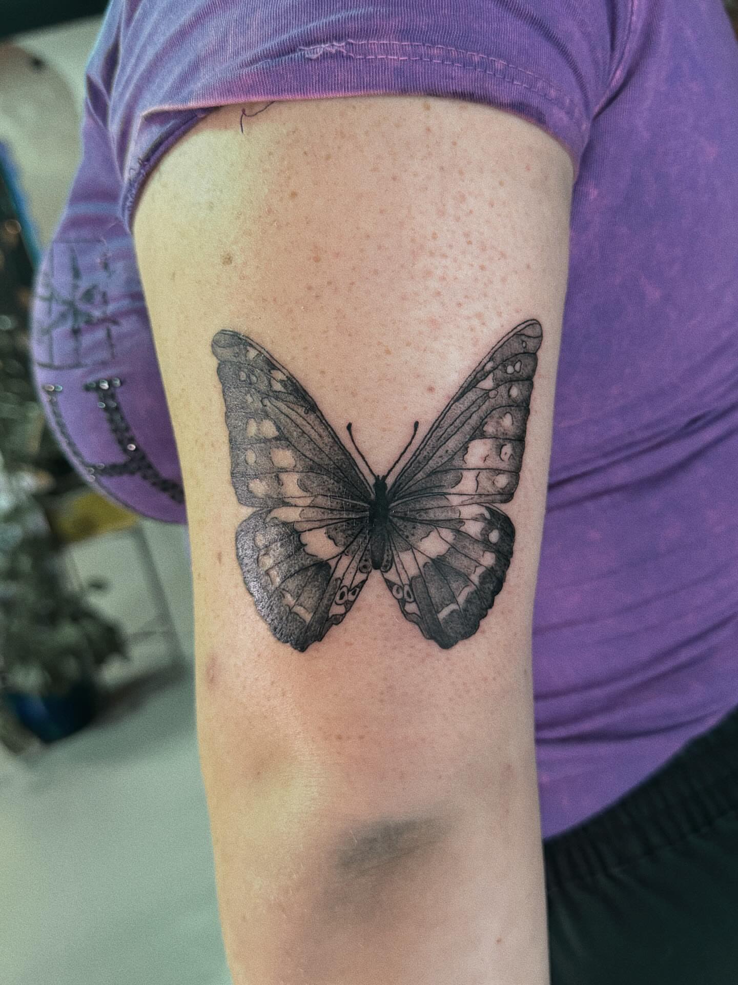 Butterfly black and grey tattoo on the forearm by Paulina Vazquez